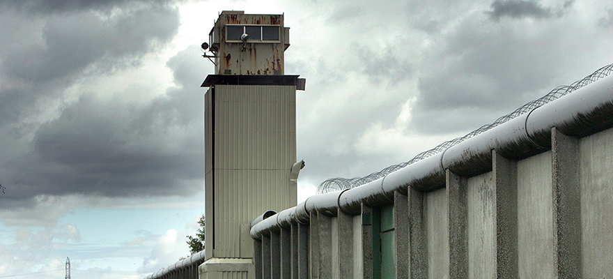 A watchtower and perimeter wall marks the boundary of the former Maze Prison, west of Belfast in Northern Ireland, U.K., Monday, Aug. 13, 2007. Photographer: Paul McErlane/Bloomberg News HOLD FOR DARA DOYLE FEATURE