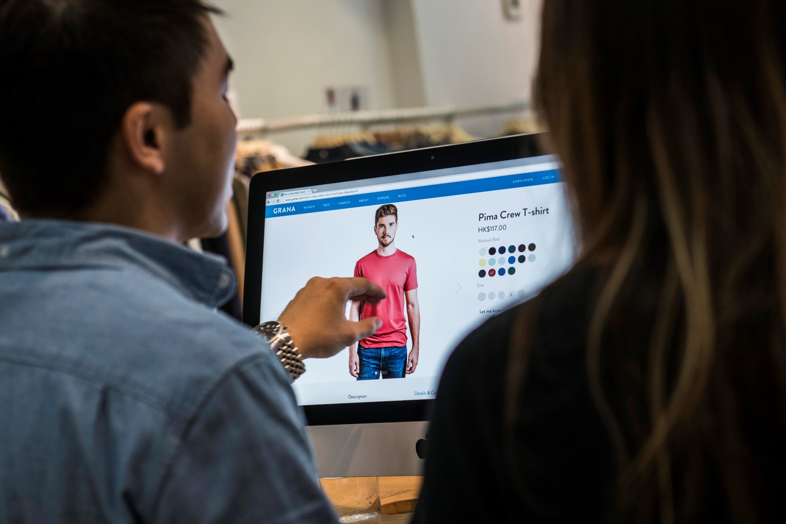 Employees use an Apple Inc. iMac computer the Grana showroom titled "The Fitting Room" in Hong Kong, China, on Tuesday, Oct. 13, 2015. Grana, a Hong Kong-based online clothing retailer, opened a permanent showroom in the Chinese city in mid September, enabling customers to try clothes on before buying them. Photographer: Xaume Olleros/Bloomberg