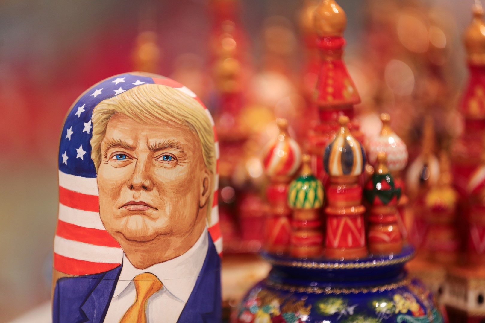 A martyoshka doll showing Donald Trump, U.S. president elect, sits beside painted wooden models of St. Basil's cathedral in a souvenir store in Moscow, Russia, Nov. 9, 2016. The ruble dropped as Donald Trump won the U.S. presidential race, driving down crude prices on concern his protectionist policies will sap global growth. Photographer: Andrey Rudakov/Bloomberg.