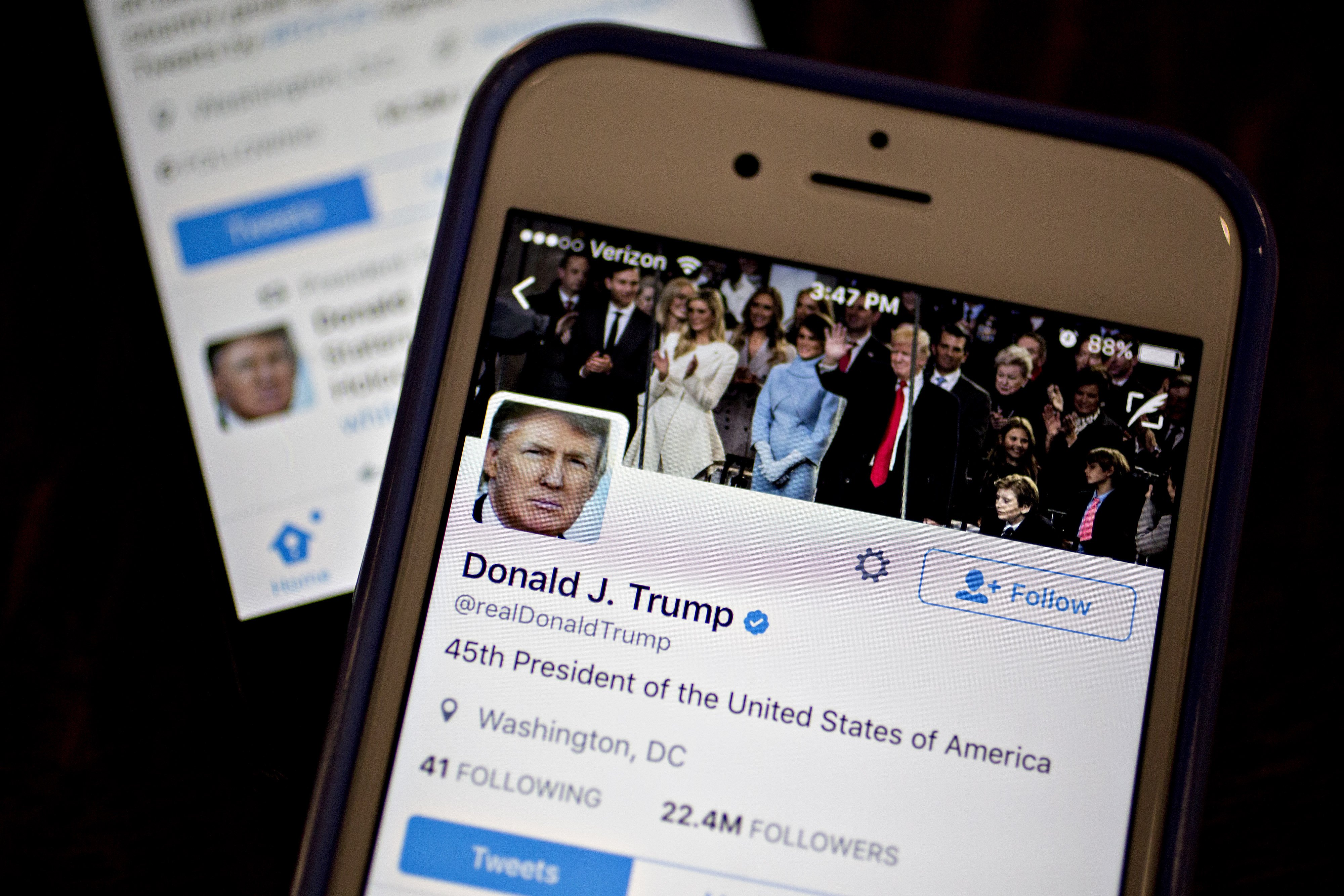 The Twitter Inc. accounts of U.S. President Donald Trump, @POTUS and @realDoanldTrump, are seen on an Apple Inc. iPhone arranged for a photograph in Washington, D.C., U.S., on Friday, Jan. 27, 2017. Mexican President Enrique Pena Nieto canceled a visit to the White House planned for next week after Trump on Thursday reinforced his demand, via Twitter, that Mexico pay for a barrier along the U.S. southern border to stem illegal immigration. Photographer: Andrew Harrer/Bloomberg