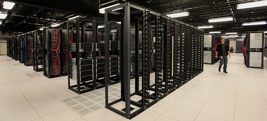 Tow rows of incomplete racks that are currently being built and prepared for usage inside pod two of IBM's Softlayer data center in Dallas, Texas, U.S., on Thursday, Jan. 16, 2014. Photographer: Ben Torres/Bloomberg
