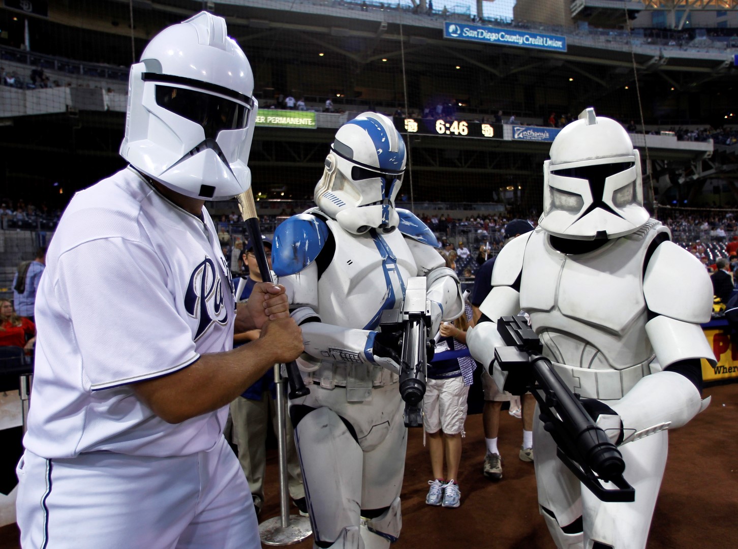 San Diego Padres relief pitcher Heath Bell (L) jokes around with Star Wars clone troopers during Star Wars night at the ball park prior to playing the Cincinnati Reds in their National League baseball game at Petco Park in San Diego, California September 24, 2010. REUTERS/Mike Blake (UNITED STATES - Tags: SPORT BASEBALL ENTERTAINMENT) - RTXSMJQ