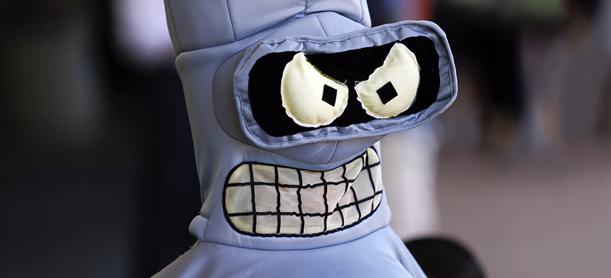 An attendee dressed in a costume of Bender from the Futurama cartoon show attends the Comic-Con International convention in San Diego, California, U.S., on Thursday, July 9, 2015. Comic-Con International is a nonprofit educational corporation dedicated to creating awareness of comics and related popular art forms. Photographer: Patrick T. Fallon/Bloomberg